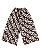 A pair of wide-leg cropped pants featuring a brown and white batik-style diagonal pattern, displayed flat against a solid white background.