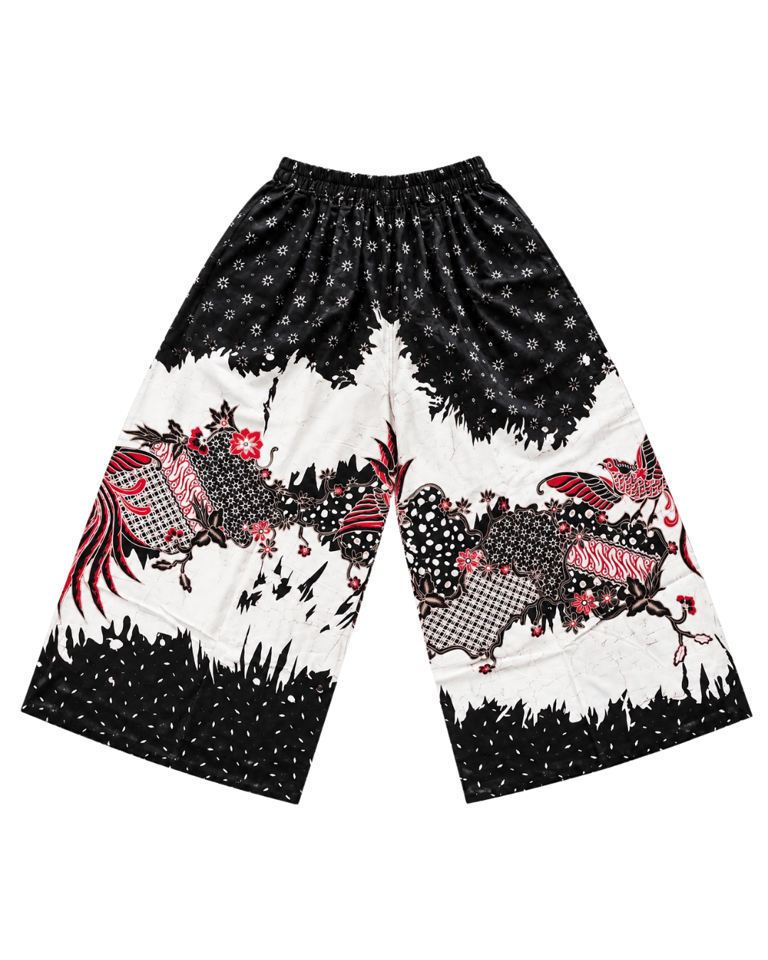 A pair of wide-leg cropped pants featuring a bold black and white pattern with red accents, including stylized birds, floral motifs, and dotted details.