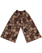 A pair of wide-leg cropped pants featuring a brown and beige batik patchwork pattern with a drawstring waist, displayed flat against a white background.