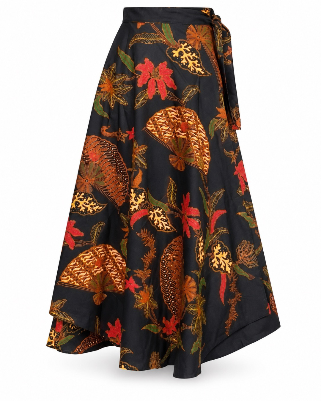A black wrap-style midi skirt with a vibrant batik-inspired print of red flowers, green leaves, and orange-brown fan motifs, shown against a plain white background.