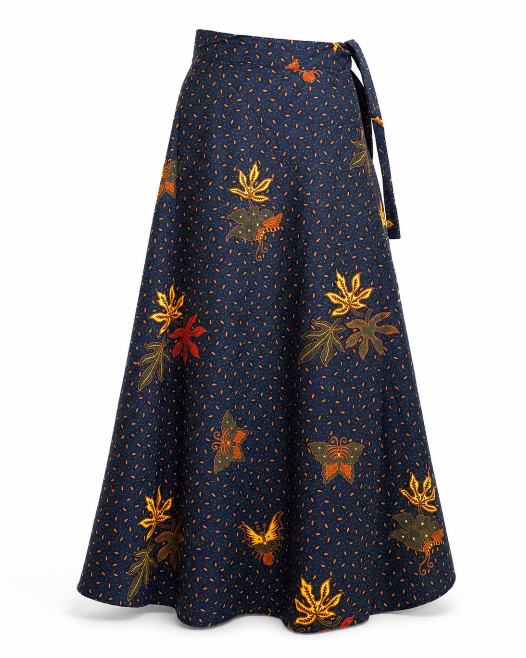A navy blue wrap-style midi skirt with a tie waist, featuring a pattern of small orange dots and orange, gold, and red autumn leaves, shown against a plain white background.