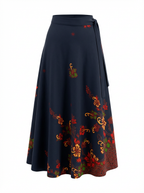 Black skirt with colorful floral patterns on a white background