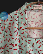 Kebaya kutubaru made from cotton poplin with chillies motif