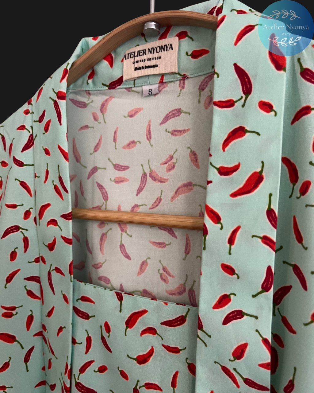 Kebaya kutubaru made from cotton poplin with chillies motif