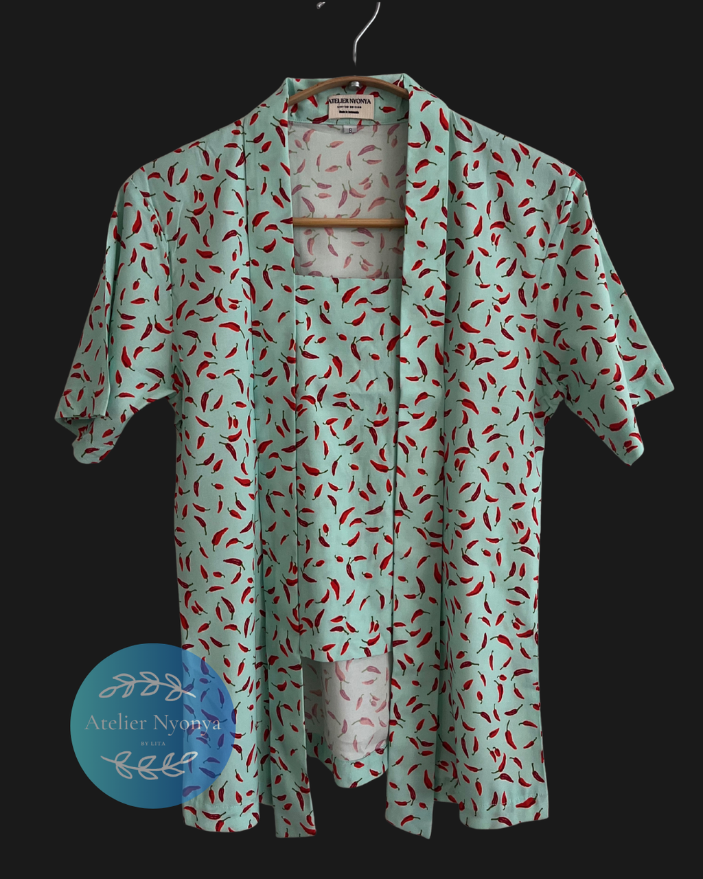 Kebaya kutubaru made from cotton poplin with chillies motif 