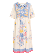 A cream-colored midi dress with a blue, yellow, and pink bohemian floral and geometric print, featuring a pointed collar and short sleeves.