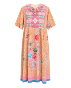 A short-sleeved midi dress with a vibrant orange and pink patterned print, featuring a floral design on the lower half and a geometric embroidered-style yoke on the upper half, finished with a blue hem.