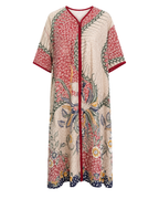 A long kaftan-style cover-up dress with a beige base and a vibrant multicolor floral and botanical print, featuring red trim along the neckline, armholes, and front placket.
