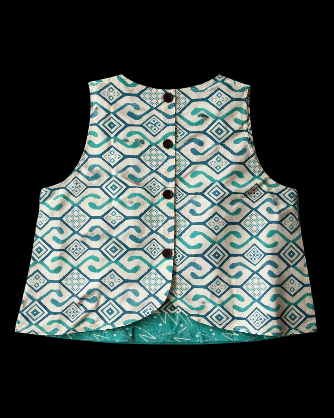 Patterned vest with buttons on a black background