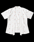 A white short-sleeve button-front shirt with a small scattered embroidered pattern in red, orange, and black, displayed flat against a solid black background.