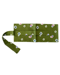 An olive green fabric accessory, likely a belt or strap, featuring a repeating pattern of small white, blue, red, and black geometric motifs, laid flat on a white background.