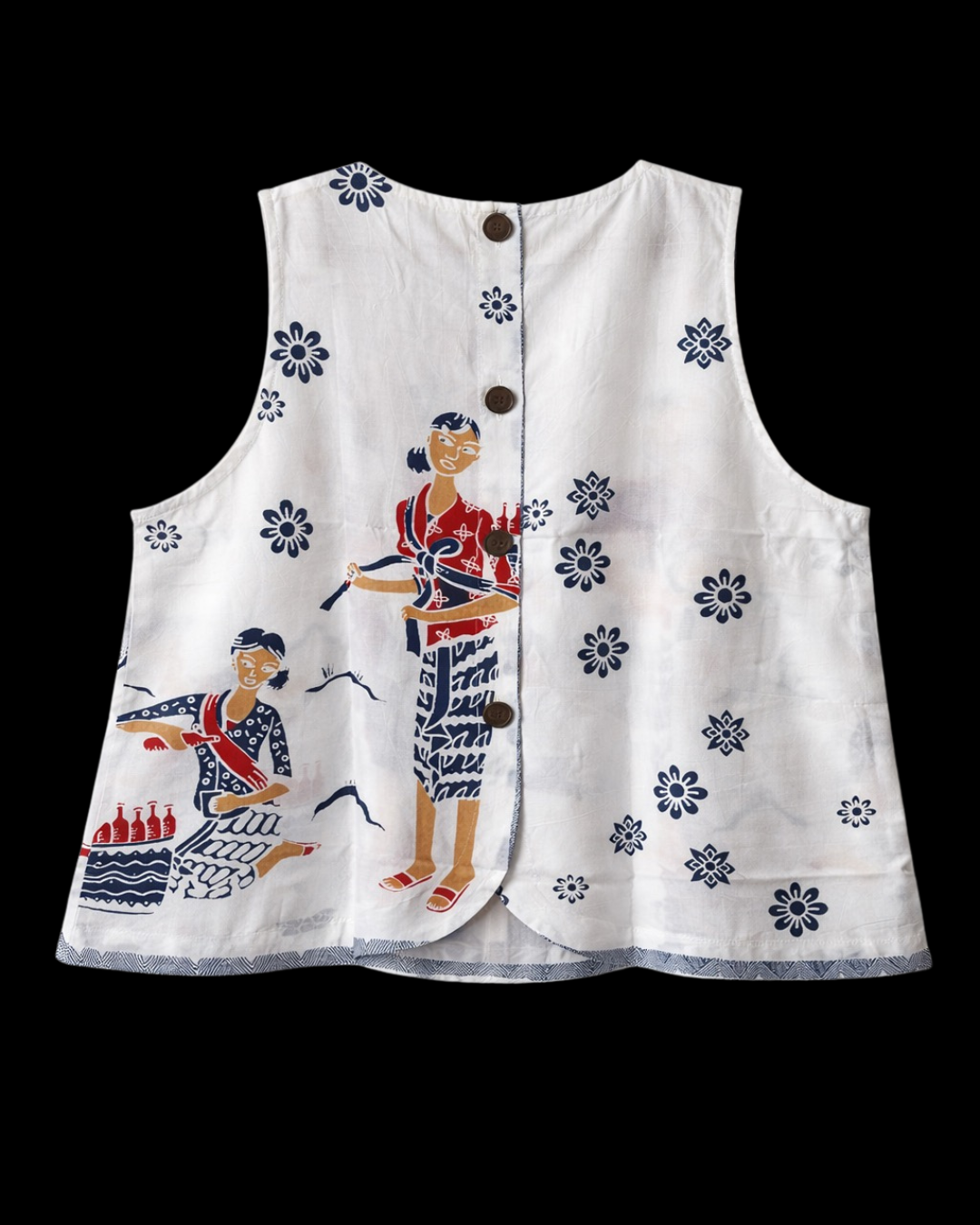 White sleeveless top with embroidered designs on a black background