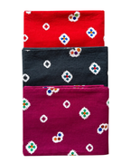 Three folded fabrics in red, black, and purple with floral patterns on a white background