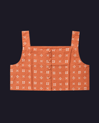 Orange crop top with white pattern on a black background